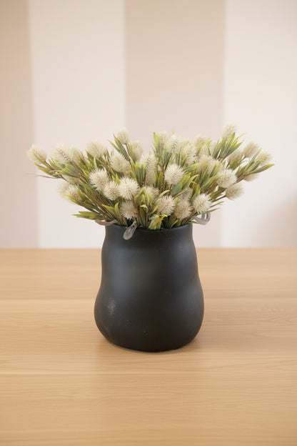 Black Maliah vase with white thistle flowers. 